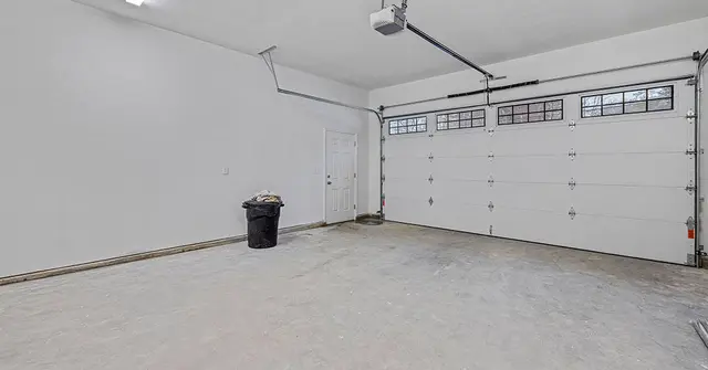 Empty white garage with windows 2023 04 27 23 03 58 utc